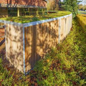 Projecten | Bijzonder gevormde fietsenstalling bij modern woongebouw | image #1 | 116144 fietsoverkapping fietsenrekken unieke vorm